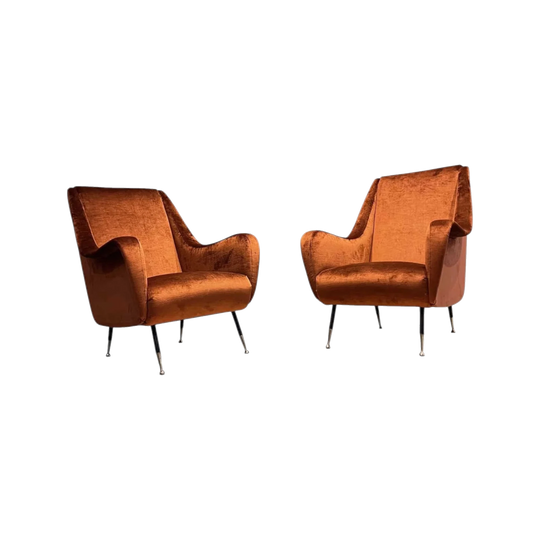 A pair of mid century modern Italian lounge chairs