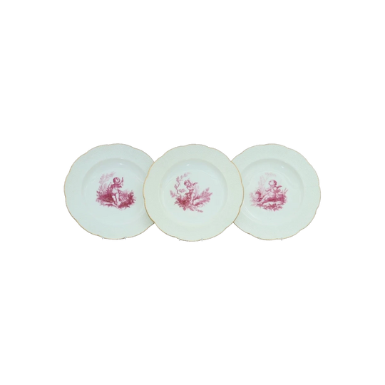 Three cherub decorated plates by Minton