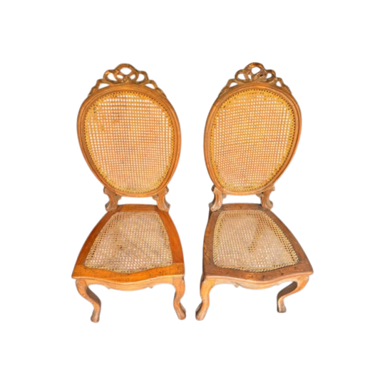Pair of Antique French Louis XVI Style Walnut Side Chairs with Ribbon Motif and Cane Backs