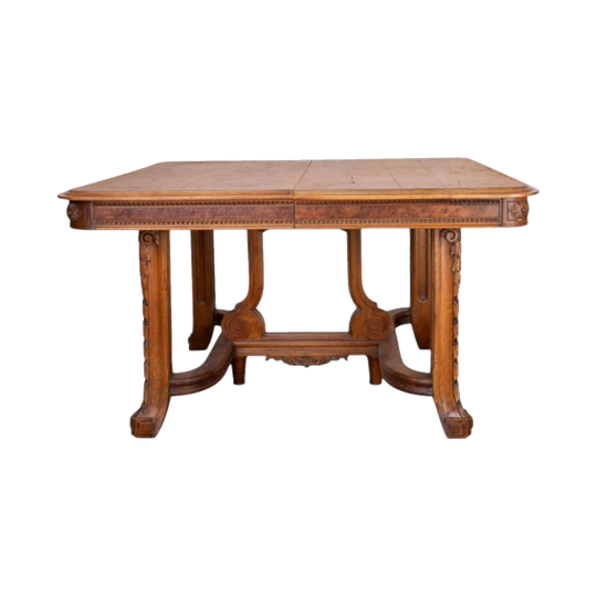 Antique French oak extendable dining table with intricate carvings and detailed stretcher base from Provence
