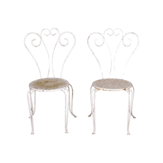 Pair of Vintage French outdoor wrought iron armchairs with a white patina