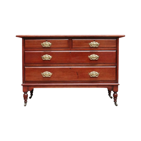 Antique English Mahogany Four-Drawer Chest with Brass Handles and Original Castors, c. 1920