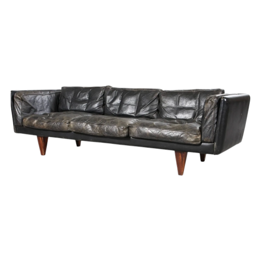 Illum Wikkelsø. Three-person sofa, model V11, black leather. Heavy but great Patina.