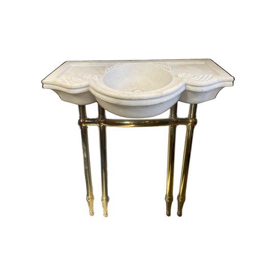 Solid marble carved basin with custom fabricated solid brass legs