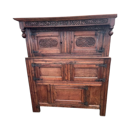 A 17th century William and Mary period carved oak court cupboard from Westmorland.