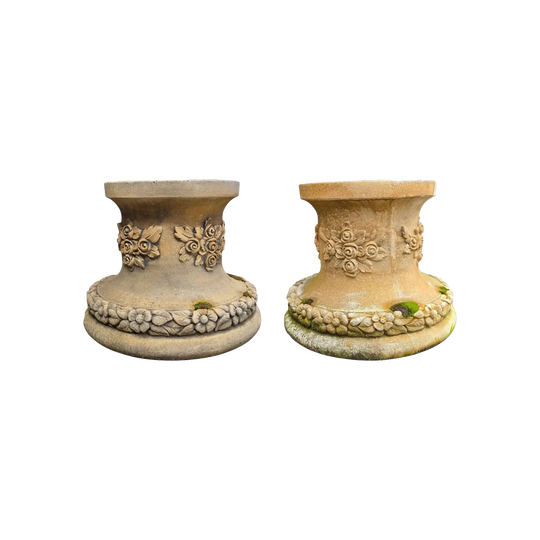 A pair of cast limestone statue or urn garden stands