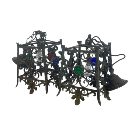 A pair of wrought Iron pendant lights