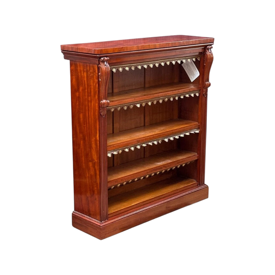English mahogany open bookcase with carved corbels and tooled leather dust covers c.1850