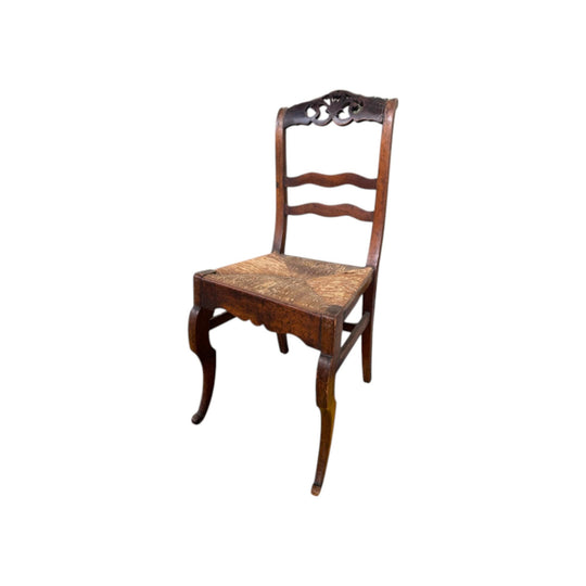 Antique French wicker chair with coquille detail