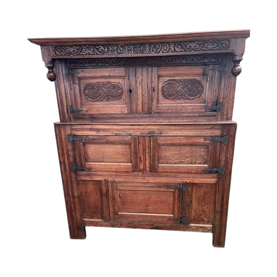 A 17th century William and Mary period carved oak court cupboard from Westmorland.