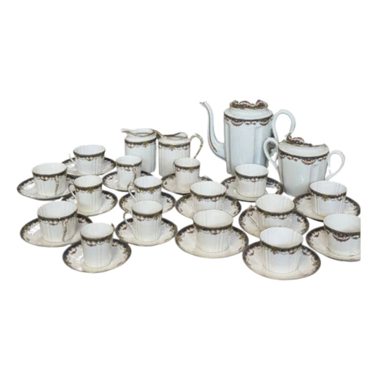 Delicate Antique French porcelain tea and coffee cup and saucers set from Paris.