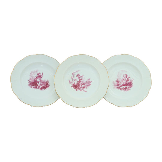Three cherub decorated plates by Minton