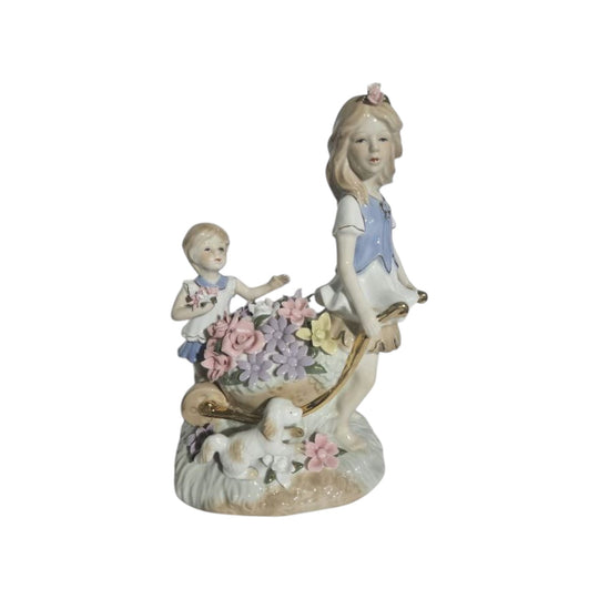 Lladro "style" Porcelaine Figure of 2 girls with Flowers in a wheelbarrow