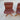 A Rare Set of 4 Vintage Joe Rufenacht Lounge Chairs in Howe Leather, featuring button-tufted upholstery and wooden crossed legs, showcases Scandinavian-inspired design on a concrete surface. Another chair from the set is partially visible on the right.