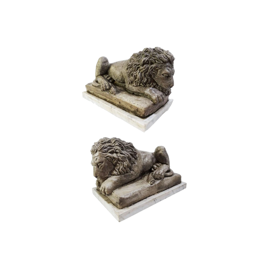 Antique Pair of Opposing Cast Stone Recumbent Lions on Marble Bases, After Antonio Canova