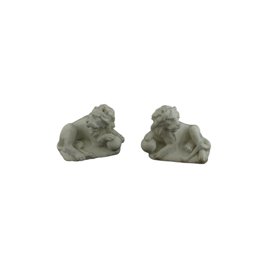 Pair of Porcelain Lions in the White, Recumbent with Ball, 10 cm