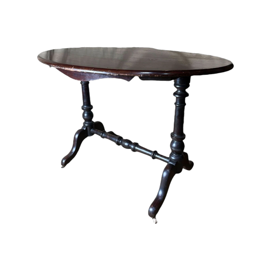 Victorian dark stained kauri pine oval table with porcelain castors, c.1860