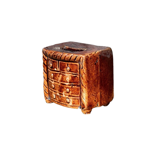 Pottery money box, 'Chest of Drawers' form, 'Rockingham' glaze, circa 1830