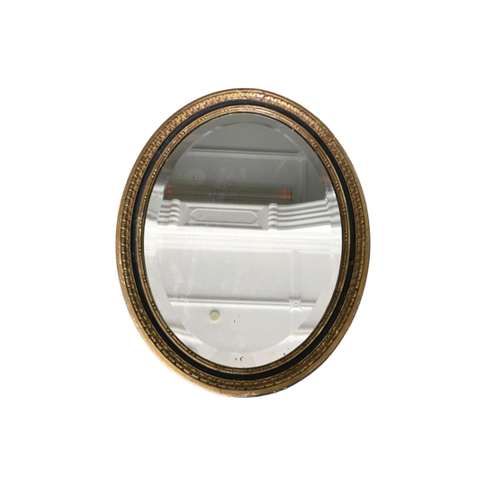 Gilt wood oval bevelled mirror, c. 1800