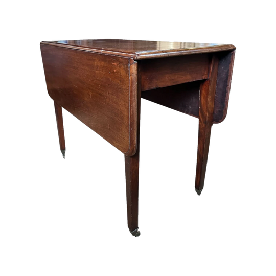 Mahogany dropside table with fine square legs and brass castors, c. 1800