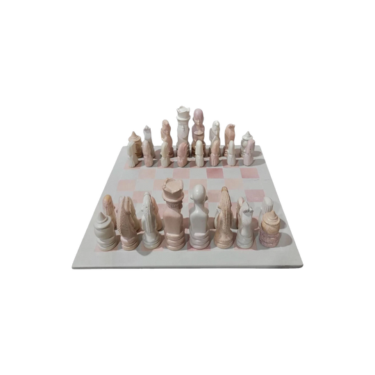 Pink and White Inlaid Stone Chess Set with African-Themed Carved Pieces