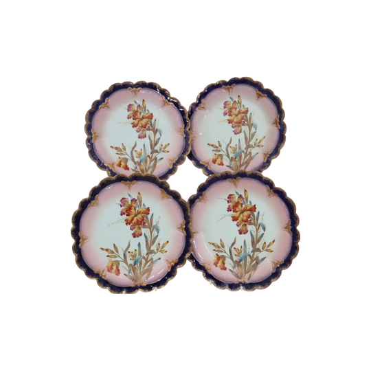 Four hand painted and gilded Limoges dessert plates