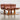A rare set of 4 vintage Joe Rufenacht lounge chairs in Howe leather, featuring curved wooden frames, are grouped on a polished concrete floor, exuding Scandinavian style against a plain light background.