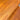 Close-up of a Rare set of Alpa Teak Nesting Tables – Set of 3, Australian Mid-Century Modern. Warm golden-brown finish with visible wood grain; one table has a noticeable scratch across the top surface.