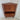 Danish mid-century teak corner cabinet with doors open revealing a mirrored cocktail bar interior, open shelf and three storage drawers.