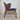 Side profile of Hans Olsen Model 107 armchair highlighting the continuous bent‑wood armrest and teak frame