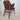 Rear view of Hans Olsen Model 107 armchair featuring the single-piece bent‑wood backrest in teak.