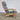 Hans J. Wegner GE290A high‑back lounge chair in solid oak with original textured fabric cushions, featuring sculptural armrests, angled legs, and classic Danish Modern craftsmanship