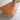 The Fully Restored Parker 140 Square Extension Table (Rediscover) features a smooth teak finish and visible wood grain, standing against a plain indoor setting with a concrete floor to highlight its timeless mid-century modern style.