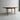 A Fully Restored Parker 140 Square Extension Table (Rediscover) with tapered legs and drop-leaf sides stands on a smooth concrete floor against a plain gray wall.