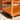 Close-up of the Mid-Century Noblett Drinks Trolley – Removable Tray & Original Castors (Revive), with rounded edges, brass castors, and warm sunlight highlighting its teak grain and smooth finish on a concrete floor.