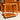The Mid-Century Noblett Drinks Trolley – Removable Tray & Original Castors (Revive) stands on a sunlit floor before matching wooden cabinetry, showcasing its modern minimalist design with rounded frames, lower shelf, and four caster wheels.