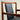 A close-up of the Pre-Order: Professional Restoration of Parker 89 Chair—pay a 25% non-refundable deposit—showing its modern wooden frame, black commercial-grade vinyl upholstery, curved armrests, and minimalist design against a light background.