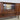 Danish mid-century rosewood sideboard with open doors revealing bar section with mirror small drawers and internal shelves
