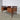 Omann Jun Model 75 teak desk showing sculpted drawer pulls and warm teak grain, Danish modern design