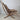 Side profile of Sigurd Ressel Falcon chair showing suspended leather seat and sculptural beech frame