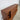 Tall mid‑century teak cabinet in good condition with sculptural offset front