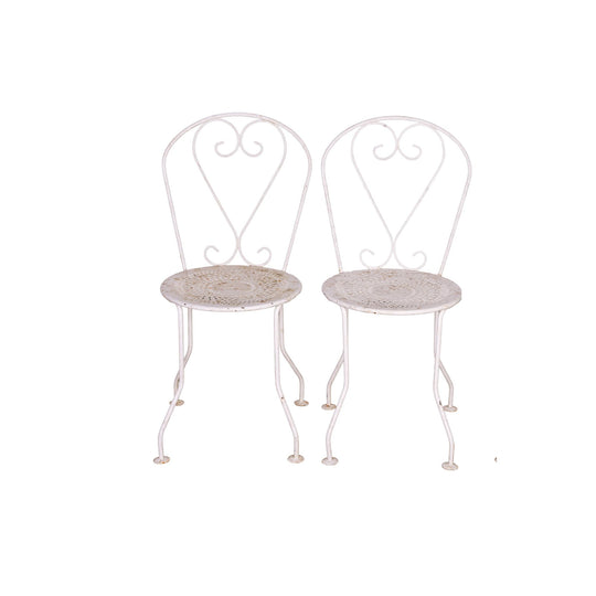 Pair of Vintage French outdoor wrought iron chairs with a white patina