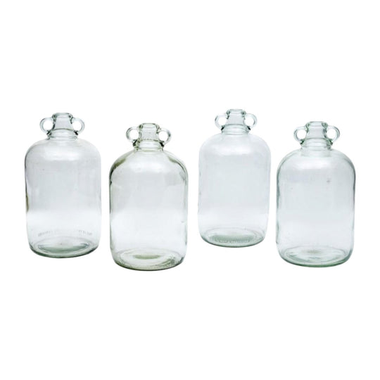 A collection of four clear glass cider bottles, English Circa 1900