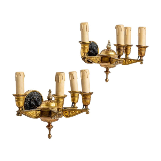 A fine quality pair of Lions head design, four branch gilt bronze Empire wall lights, French early 19th Century