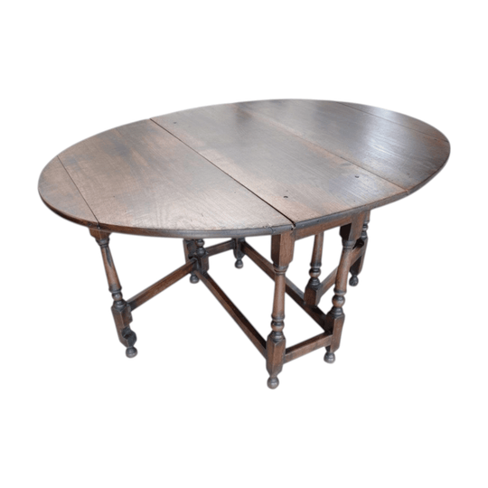 A mid 18th century oak drop-side table.