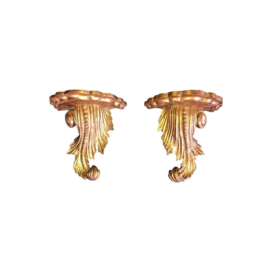 A pair of antique Italian carved gilt wood brackets
