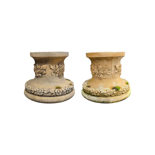 A pair of cast limestone statue or urn garden stands
