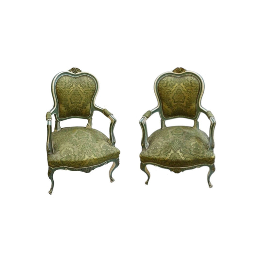 A pair of early French Louis XV style arm chairs