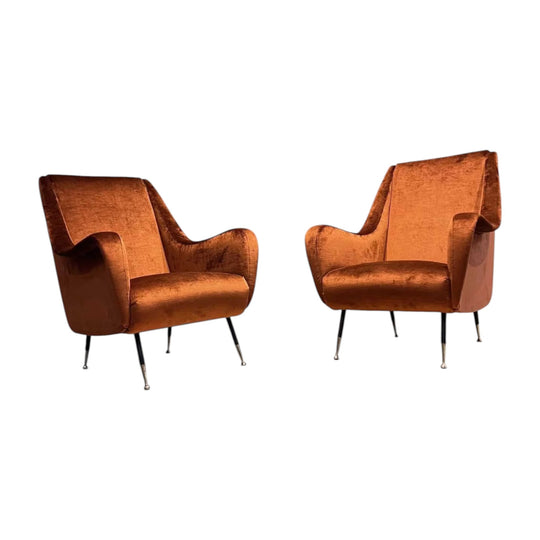 A pair of mid century modern Italian lounge chairs