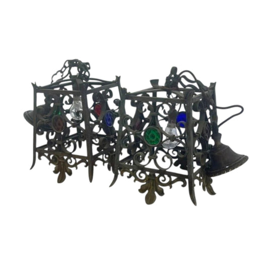 A pair of wrought Iron pendant lights